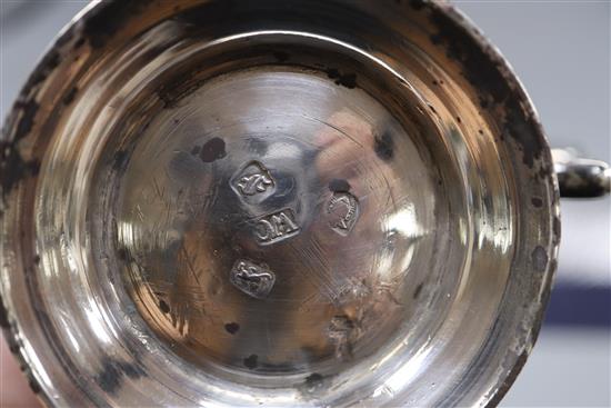 An early George III small silver baluster mug, with later engraved monogram, William Cripps, London, 1761, 9.3cm, 5.5 oz.